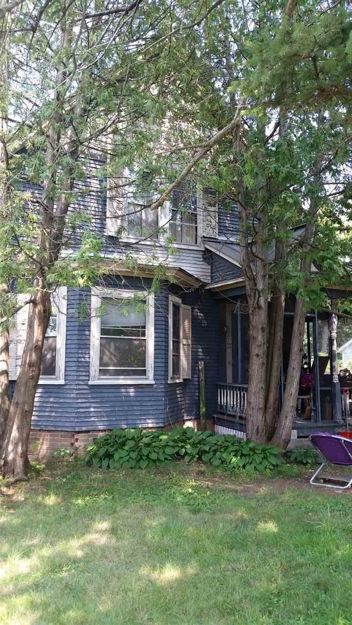 Circa 1900 2 family home.  Original door and trim 