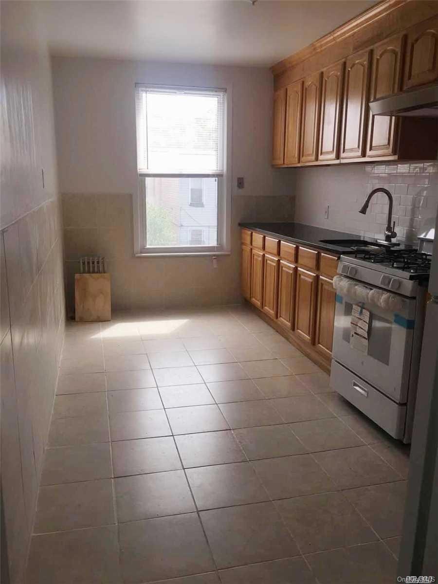 9511 93rd St unit 2 Fl, Ozone Park, NY 11416 - photo 1