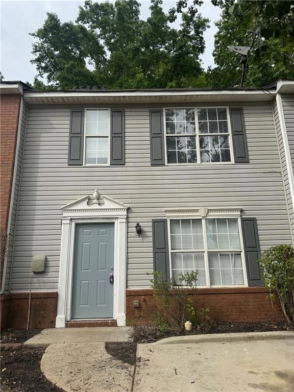 View of front of property featuring brick siding