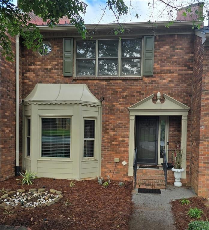 View of front of home with brick siding