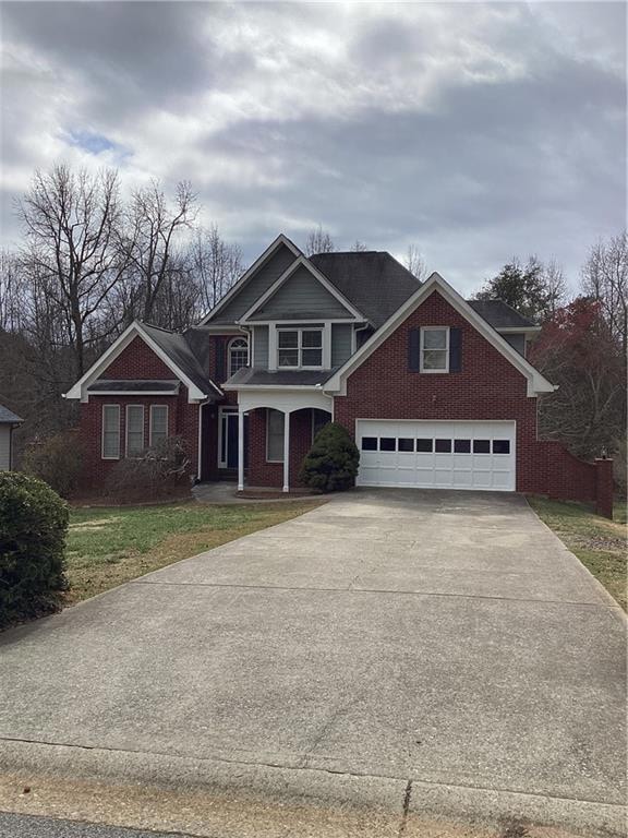 View of front of property with a front lawn, concr