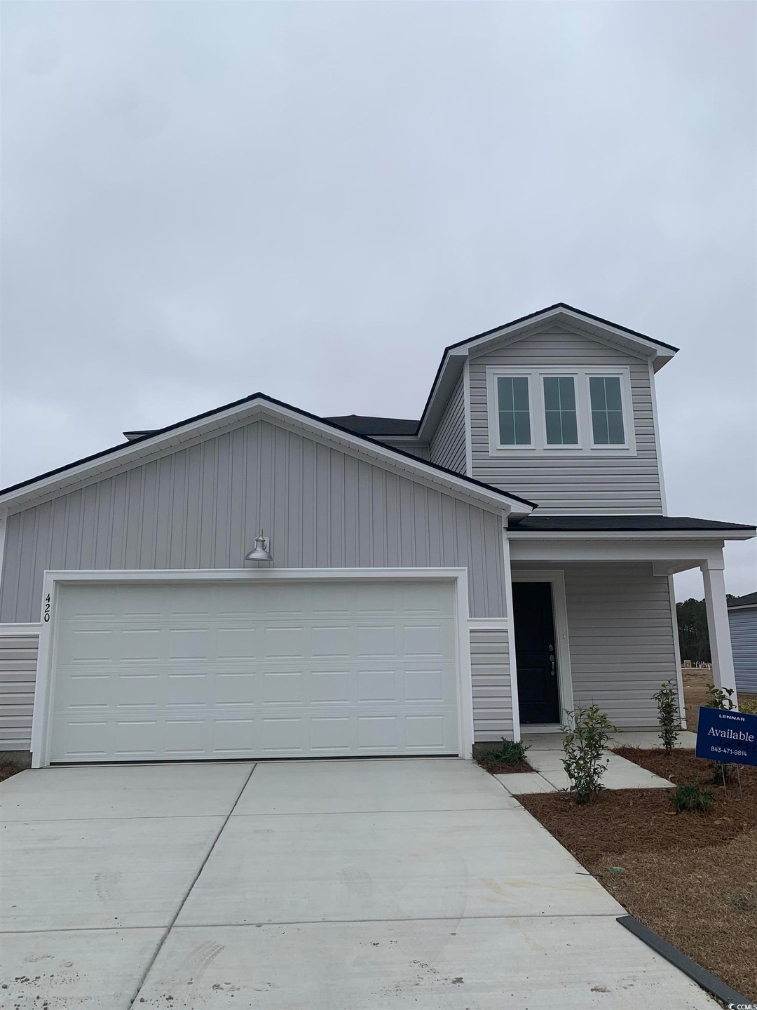View of front of house with an attached garage and