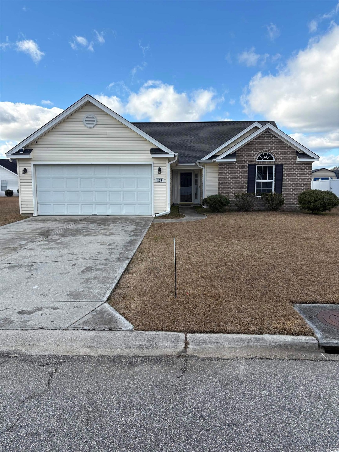 Ranch-style house featuring a garage