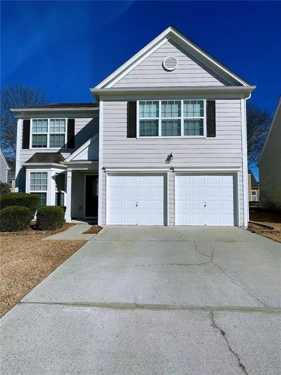 View of front property with a garage