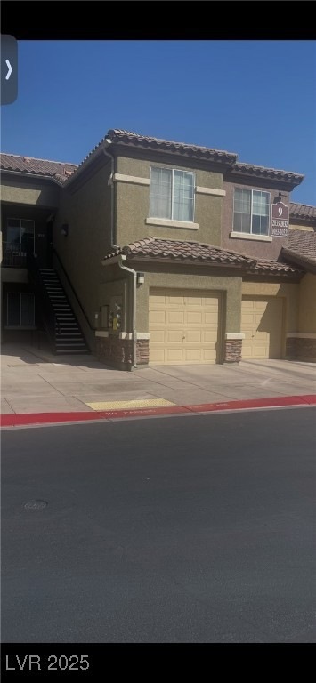 Multi unit property featuring driveway, stone sidi
