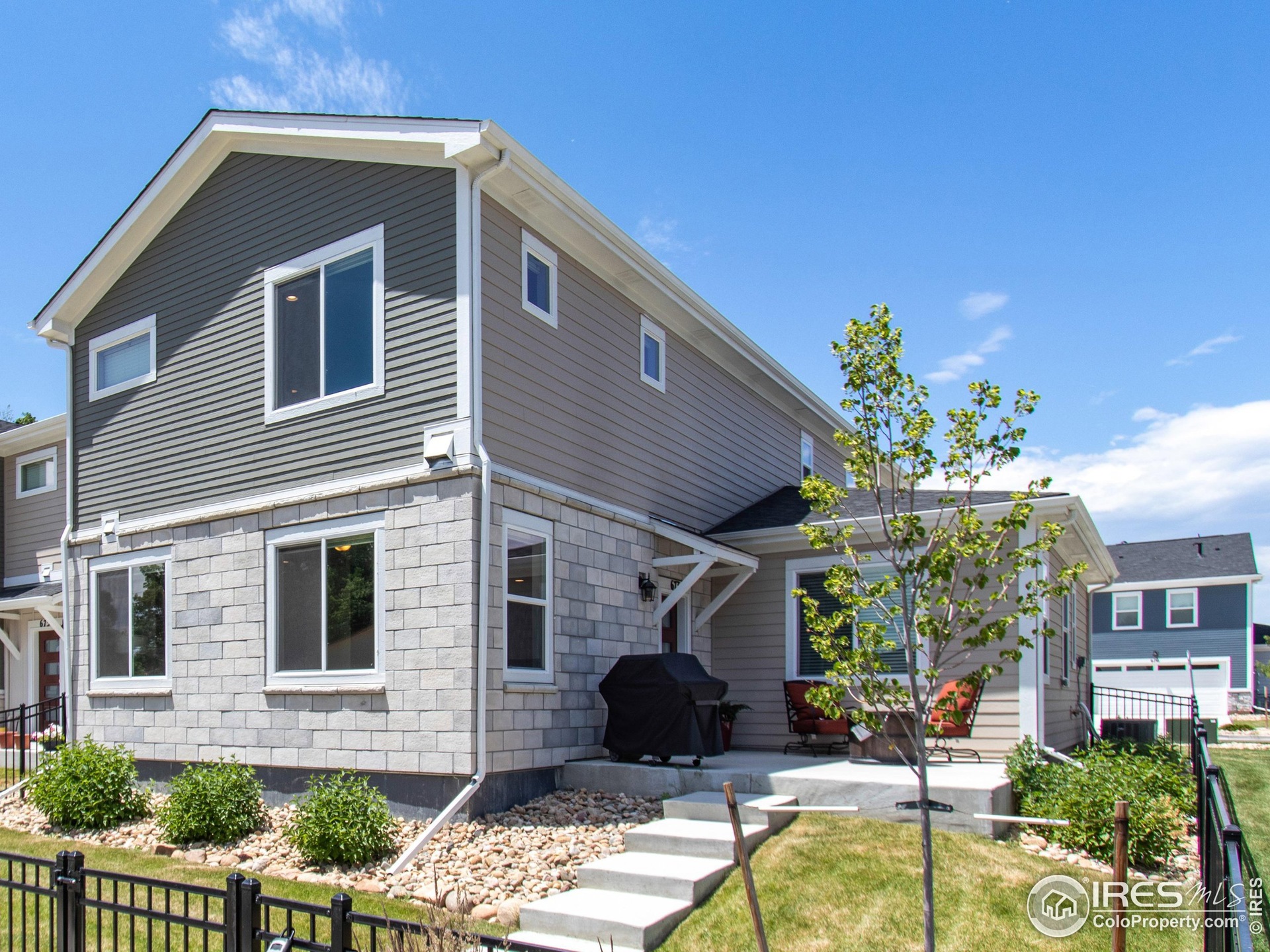 Welcome Home! You'll love the unique exterior finishes of the units in the Neighborhood.  It truly adds to the appeal of the development by eliminating the cookie cutter feel you get in other developments.