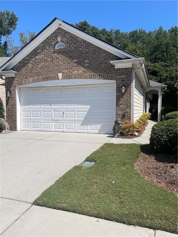 View of home's exterior with a yard