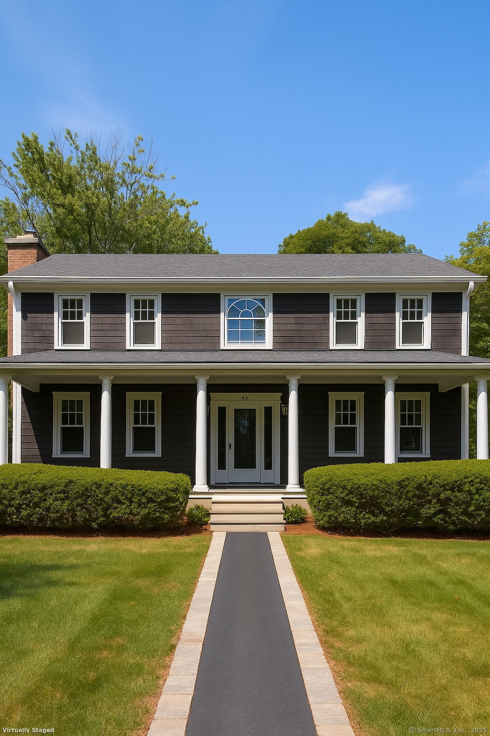 This property with cleared off porch and all trees and shrubs cut back appropriately for a more open clean look in the front yard.