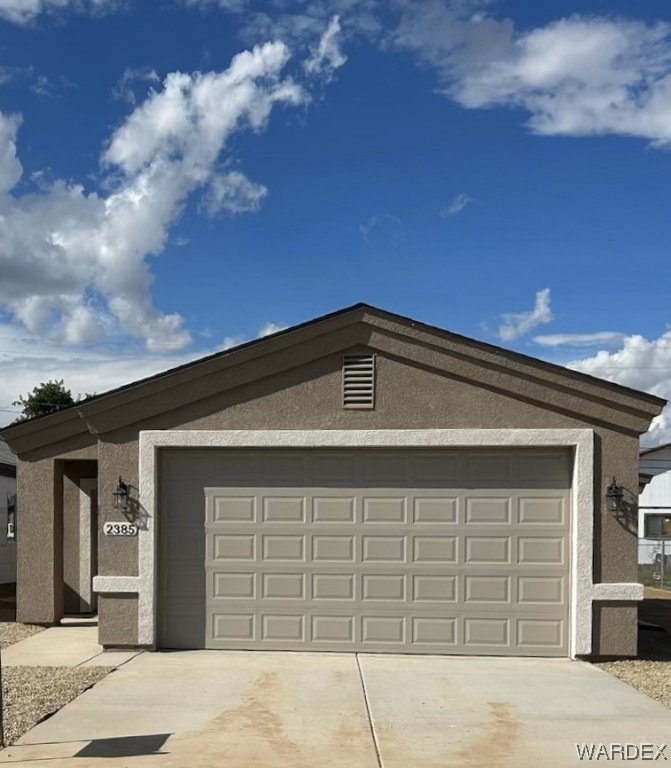 Ranch-style house featuring a garage