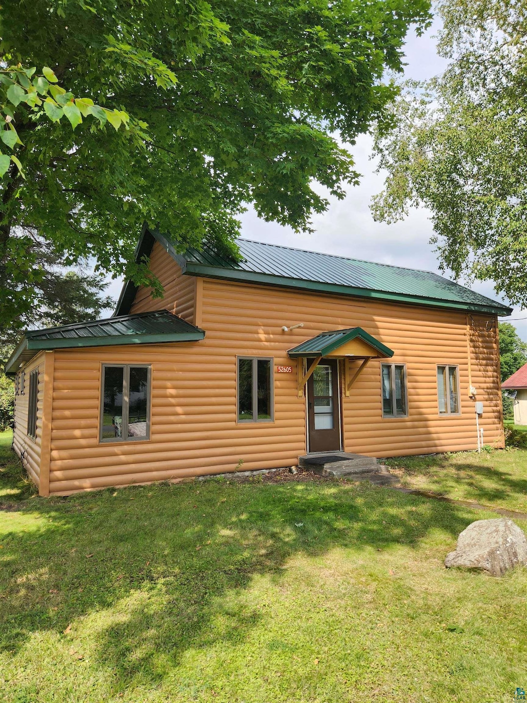 View of front of property with a front lawn