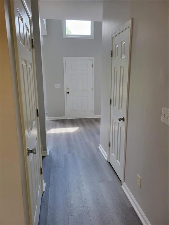 Hall featuring dark hardwood / wood-style flooring