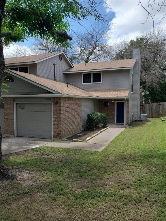 Traditional home featuring an attached garage, a 