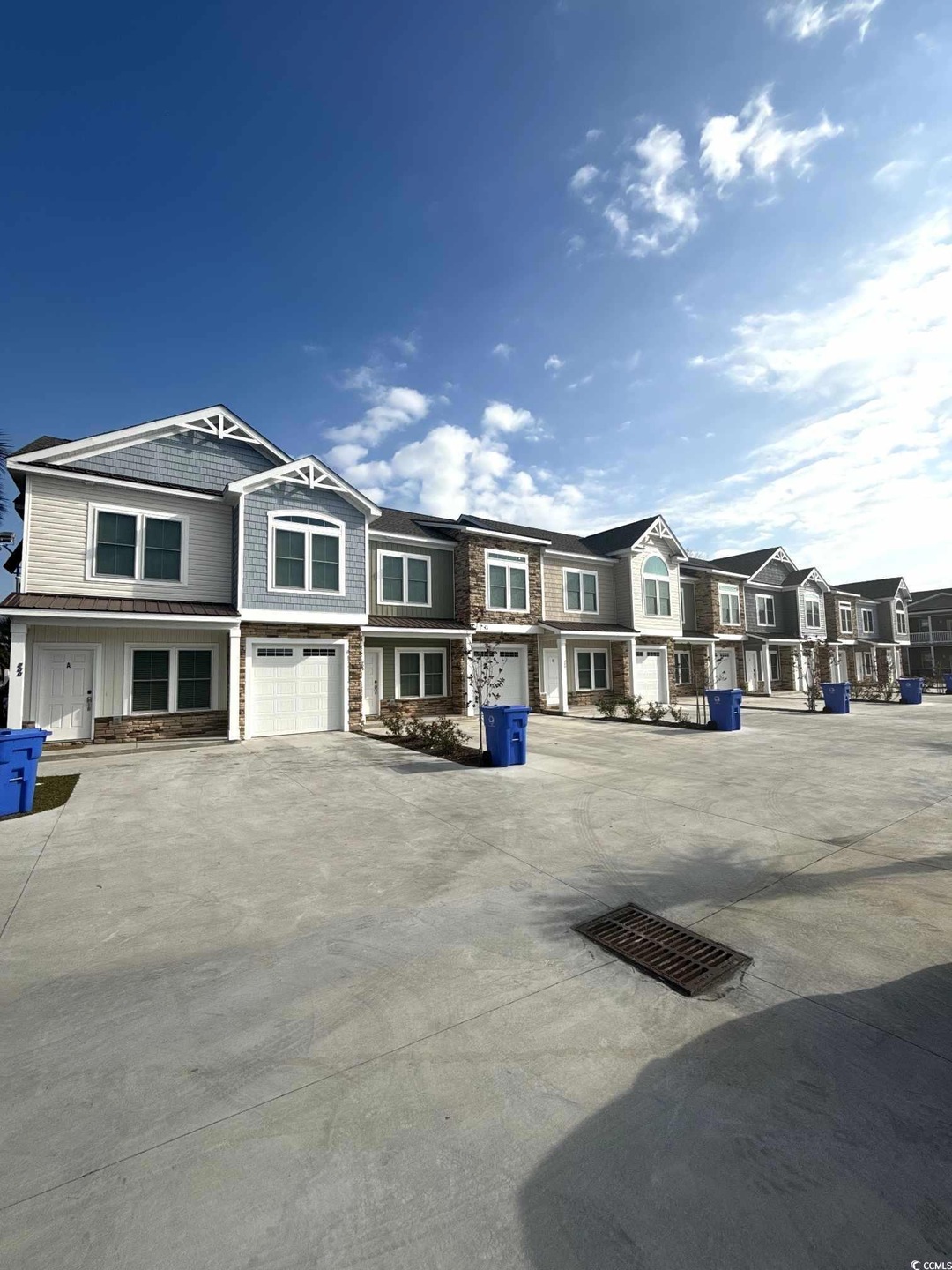 Townhome / multi-family property featuring a garag