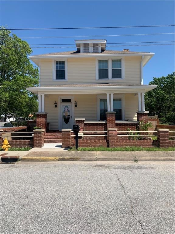 View of front of home featuring cooling unit