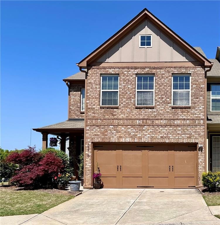 View of front of property with brick siding, drive
