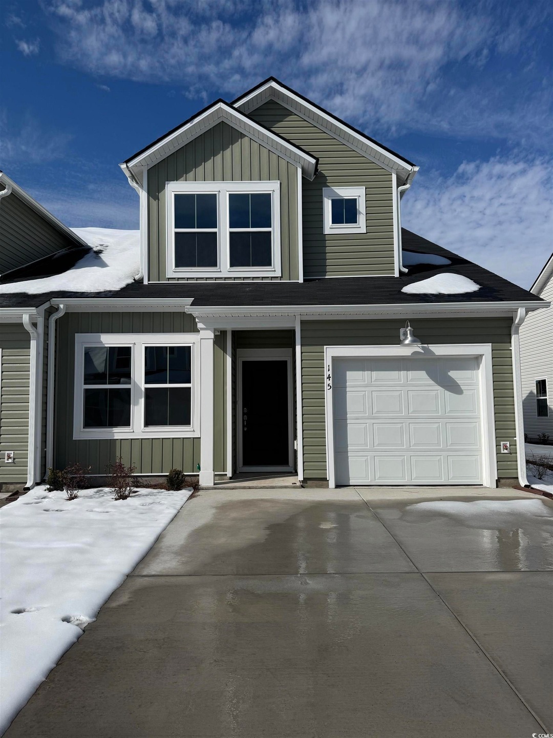 View of front of property with a garage