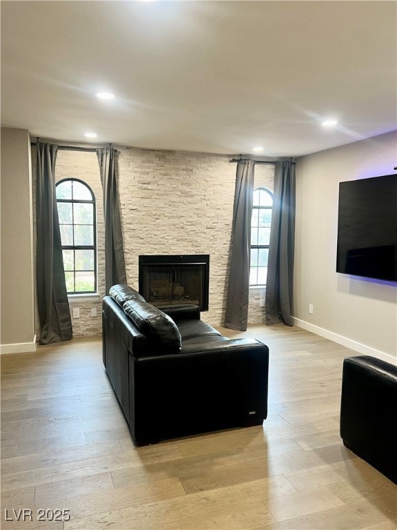Living room with plenty of natural light, baseboar