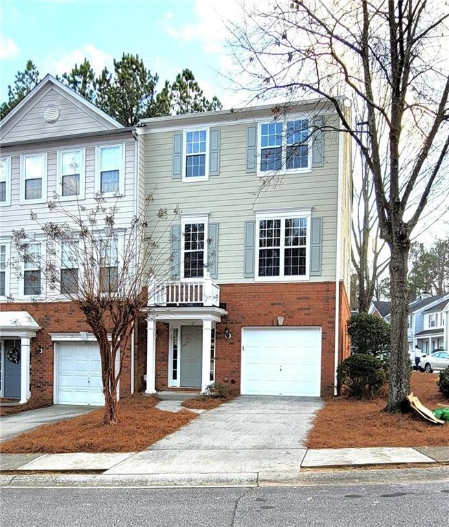 View of front of property with a garage