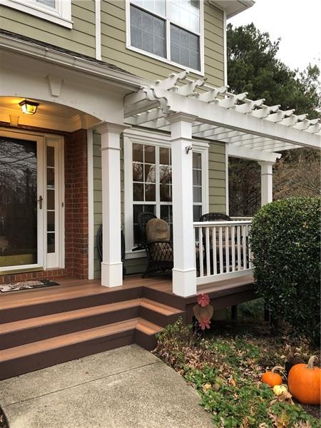 Wrap around front porch made of Trex and easy main