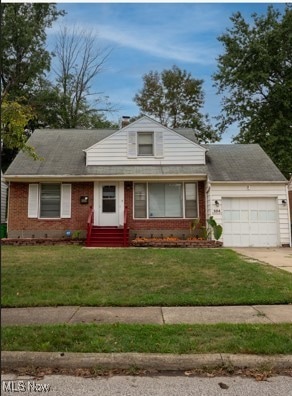 View of front of home with a front lawn, a garage, brick siding, and driveway