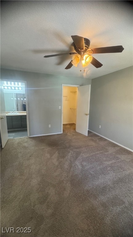 Unfurnished room featuring carpet and baseboards