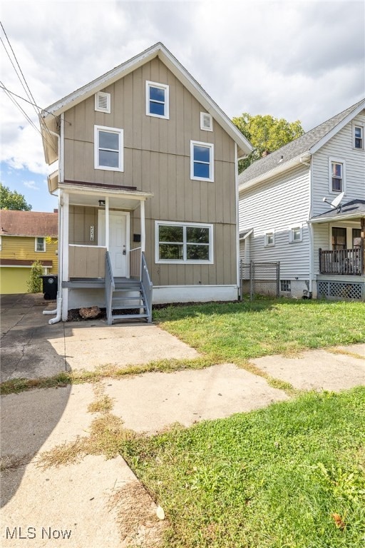 View of front of house with board and batten siding