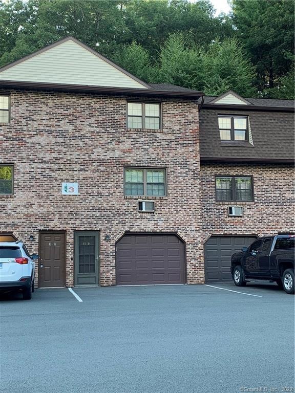 Front Exterior w/ one car garage under unit