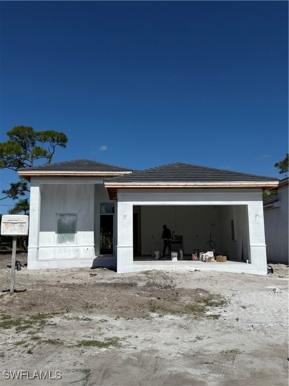 View of front of property with a patio area