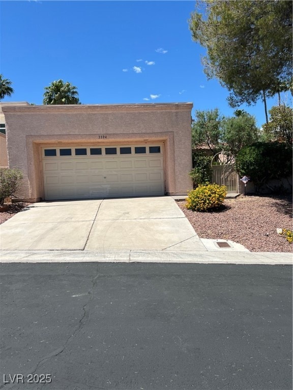 View of front of property featuring concrete drive