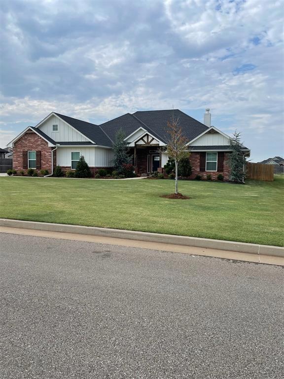 Single story home with a front yard