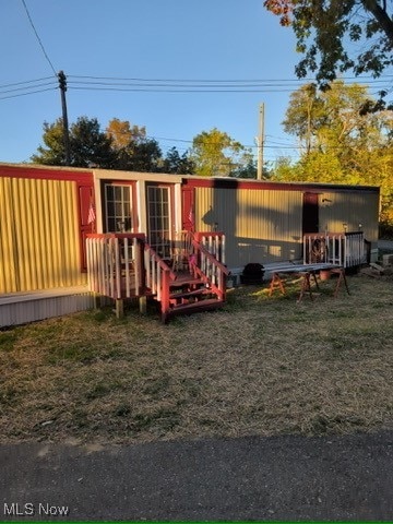 View of playground with a lawn