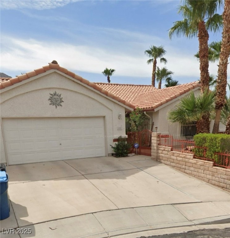 View of front of property featuring a tile roof, s