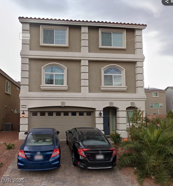 View of front facade featuring central AC unit, an