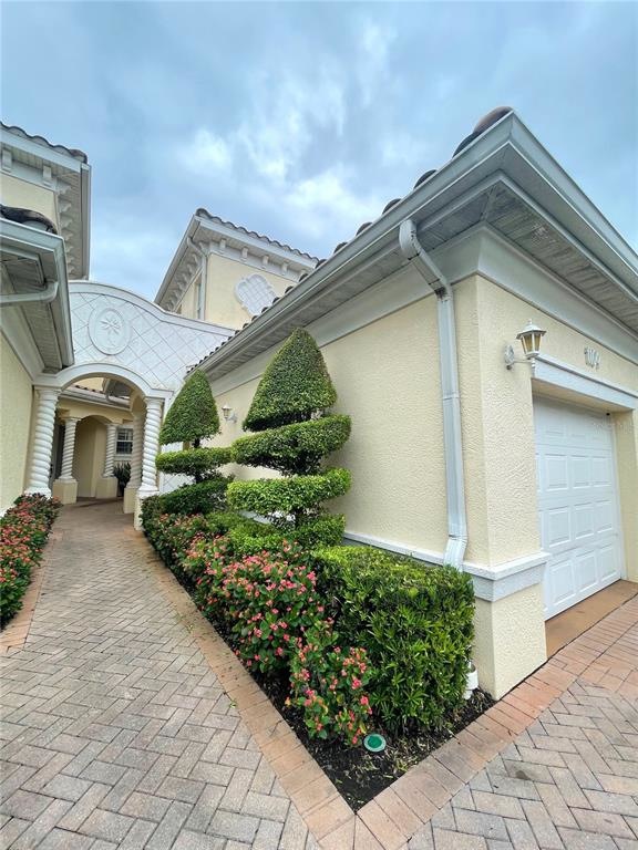 Garage and walkway to courtyard front door