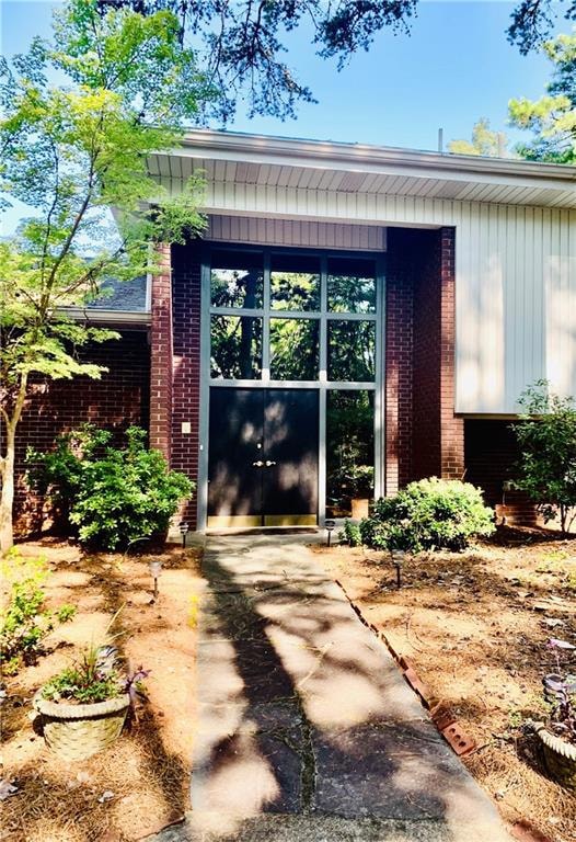 Elegant stone paved path to double front entry.