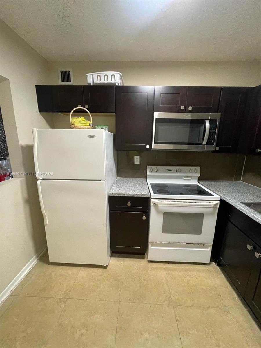 Bella Venizia unit 209, Hialeah, FL 33014 - photo 1