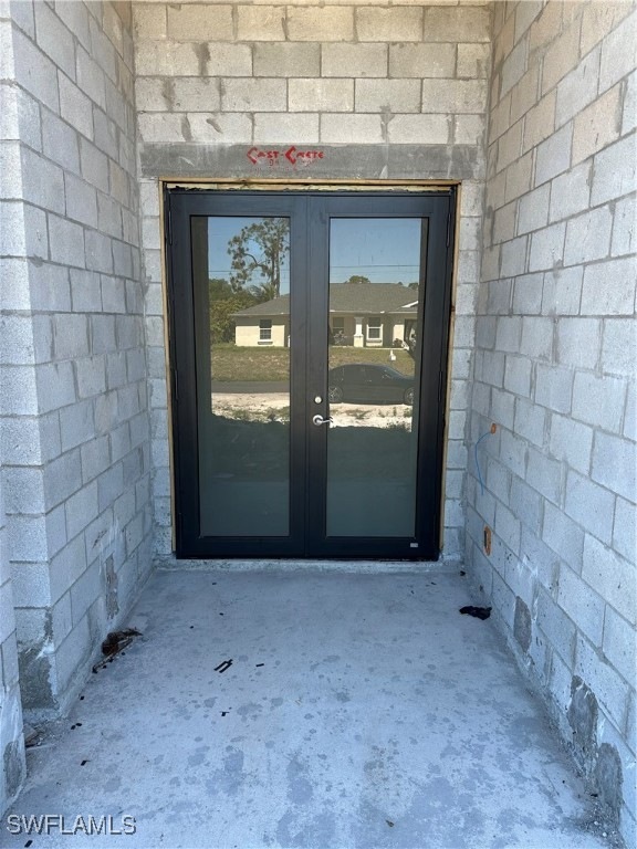 Property entrance with french doors