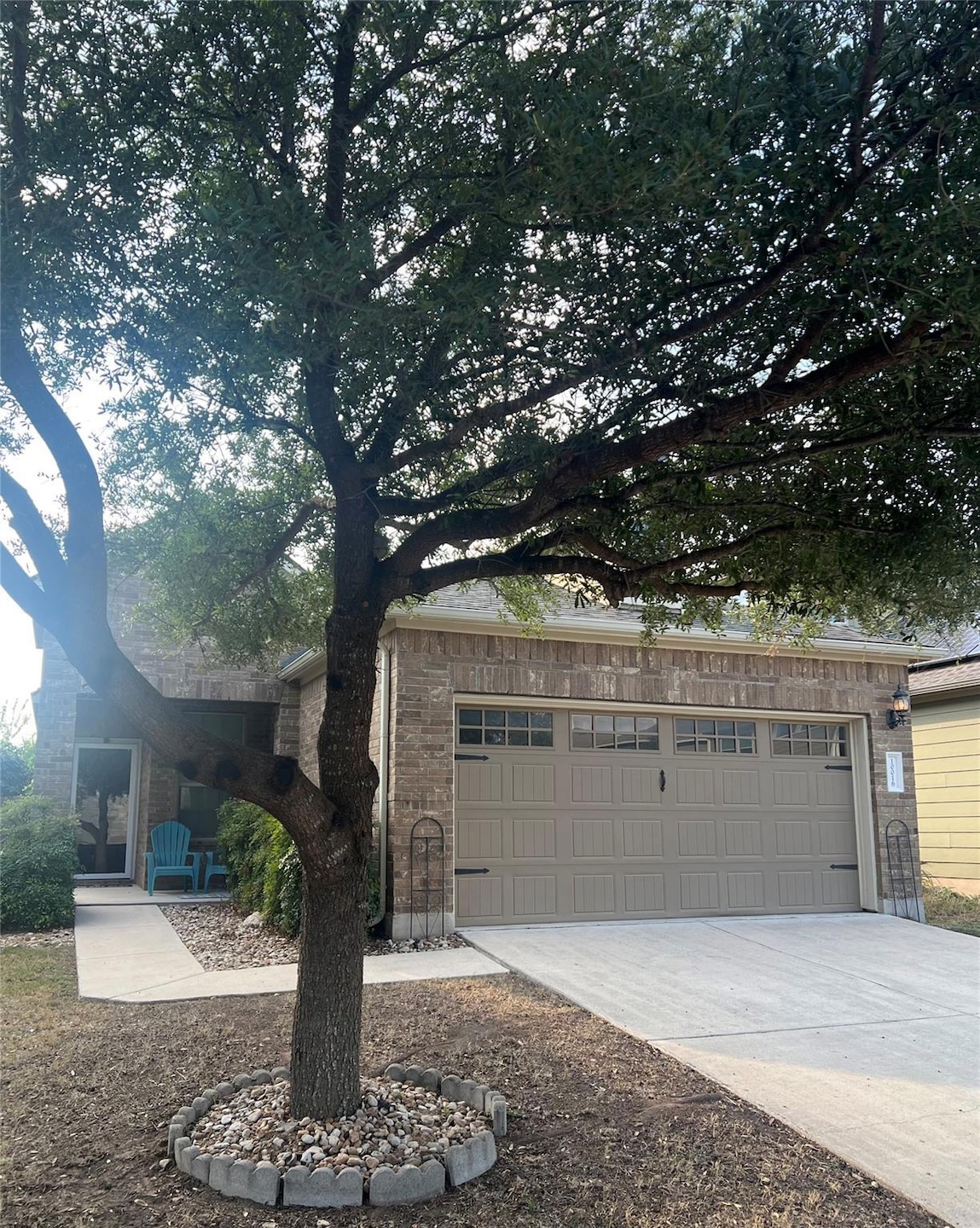 View of front of house with concrete driveway