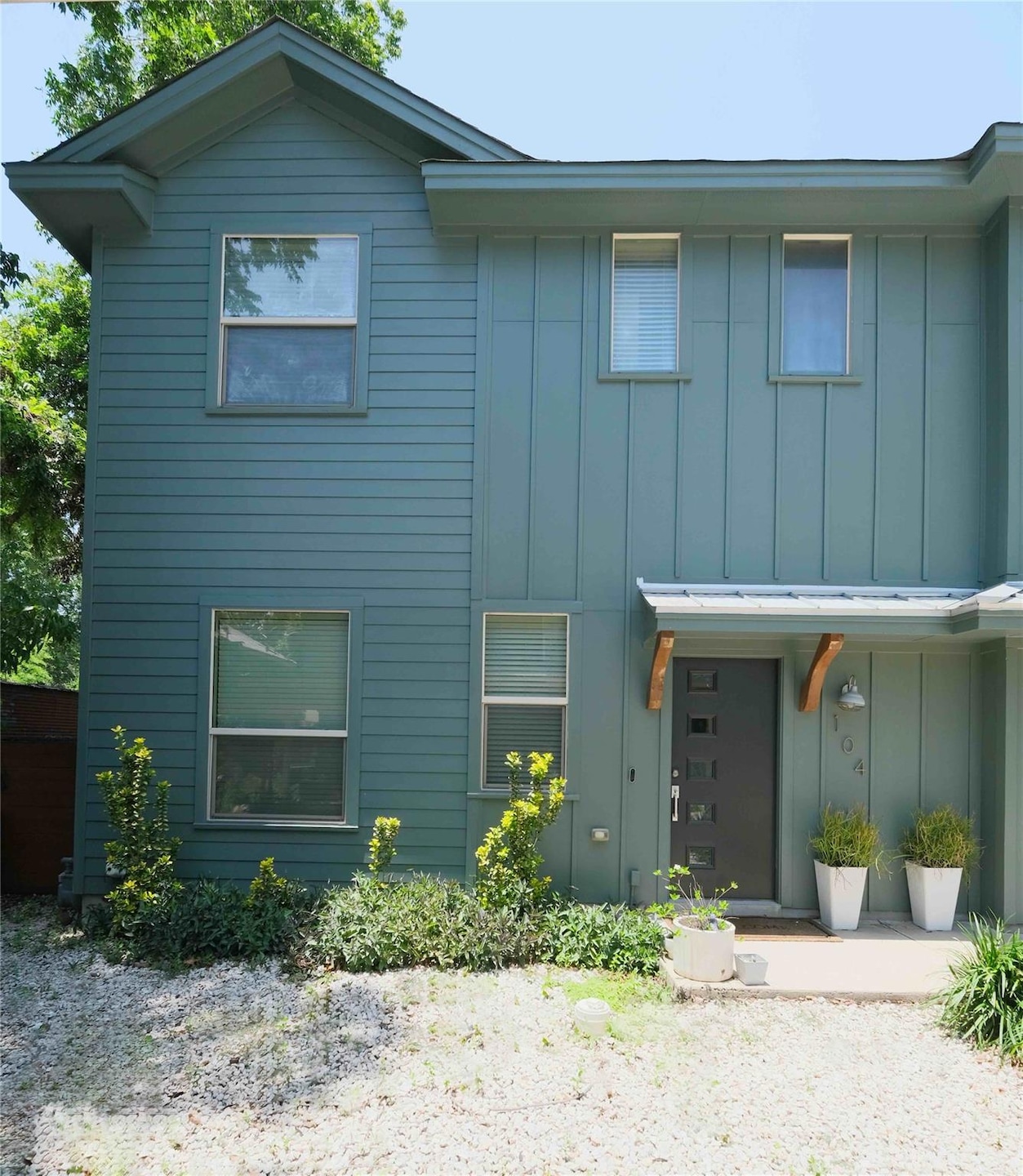 View of front facade with board and batten siding