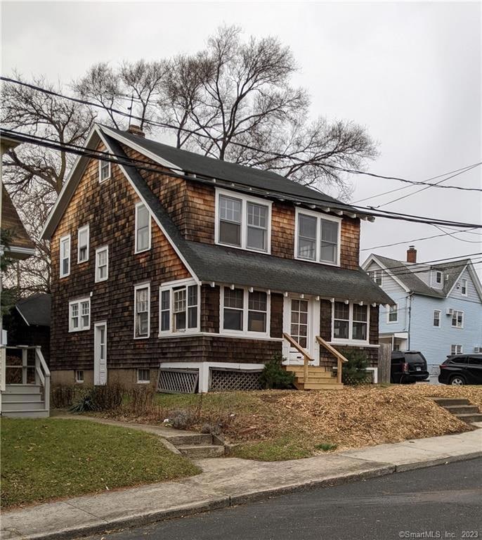 Home sits on corner property w/sidewalk