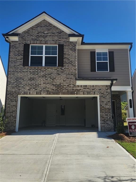 View of front property featuring a garage