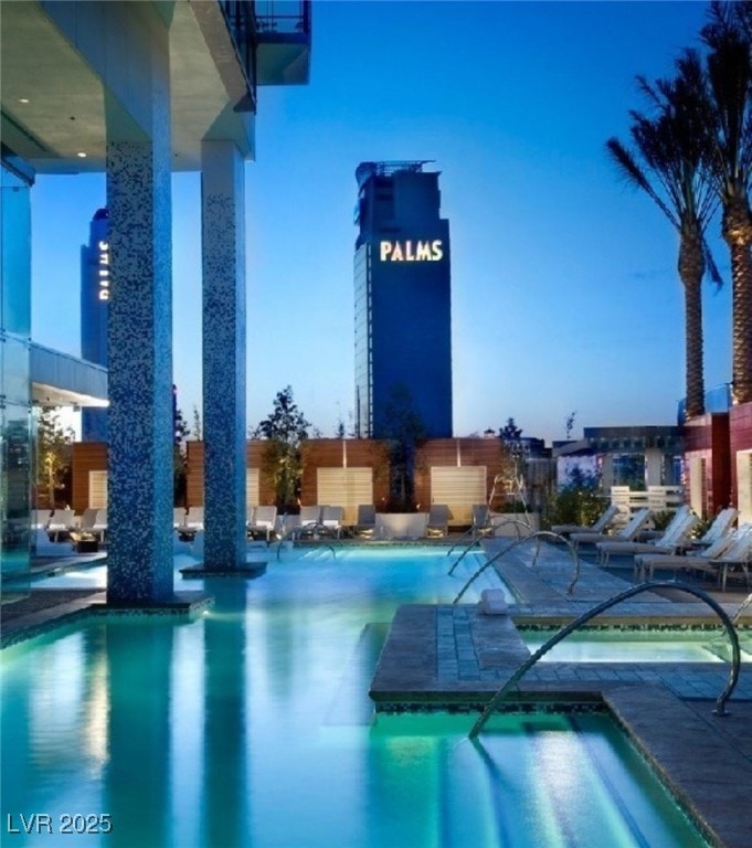 Gorgeous huge pool with plunge pool with chairs an