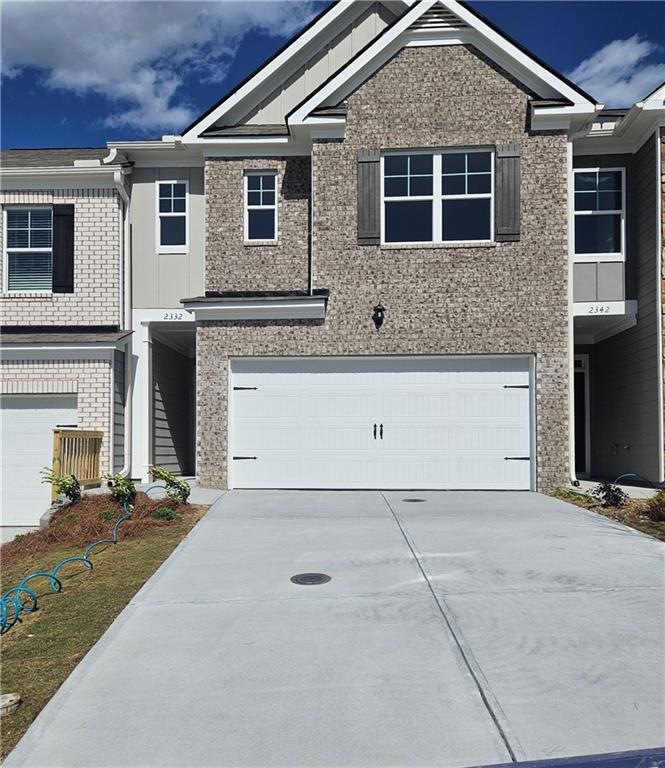 View of property featuring a garage