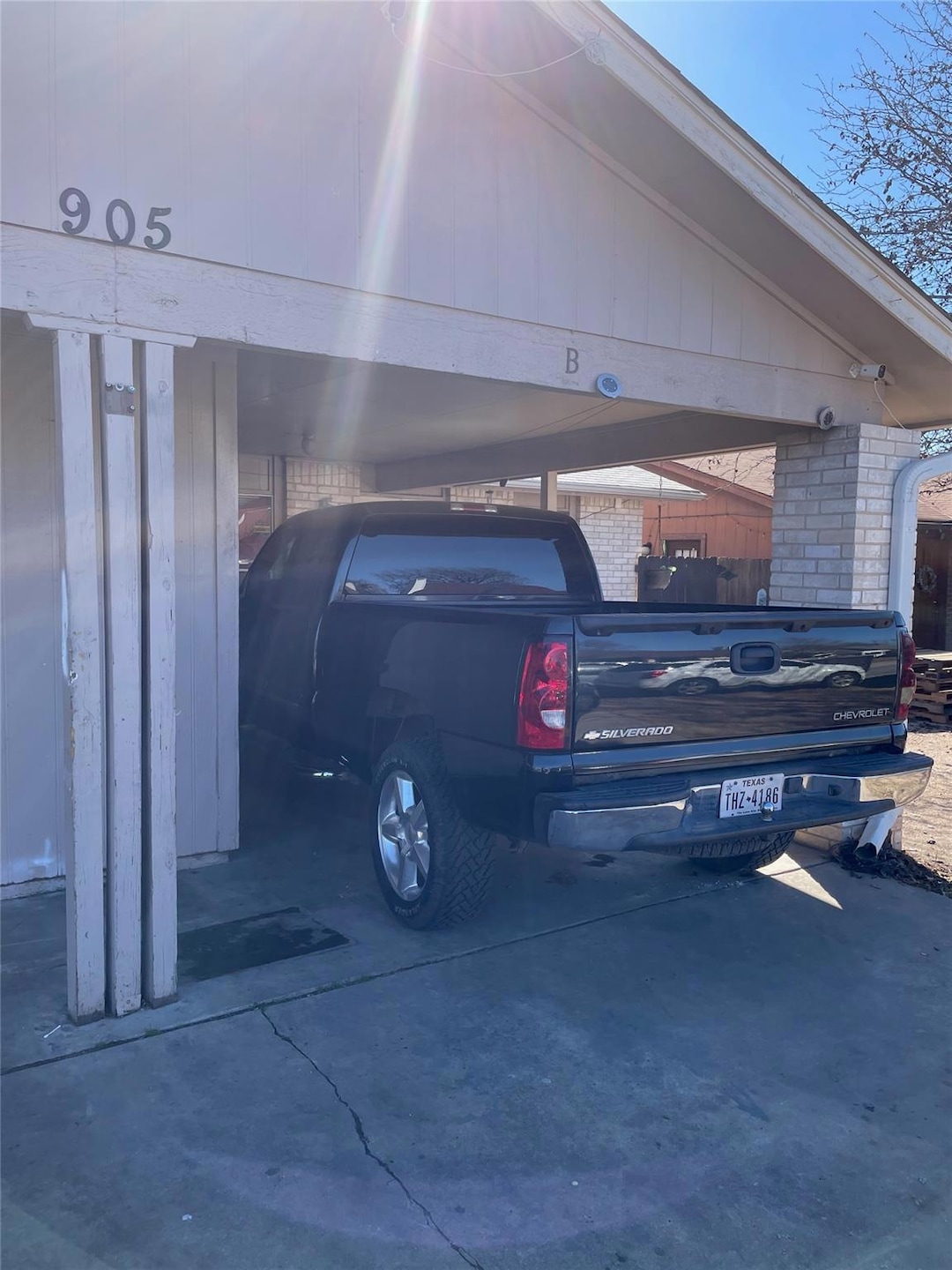 View of vehicle parking with a carport