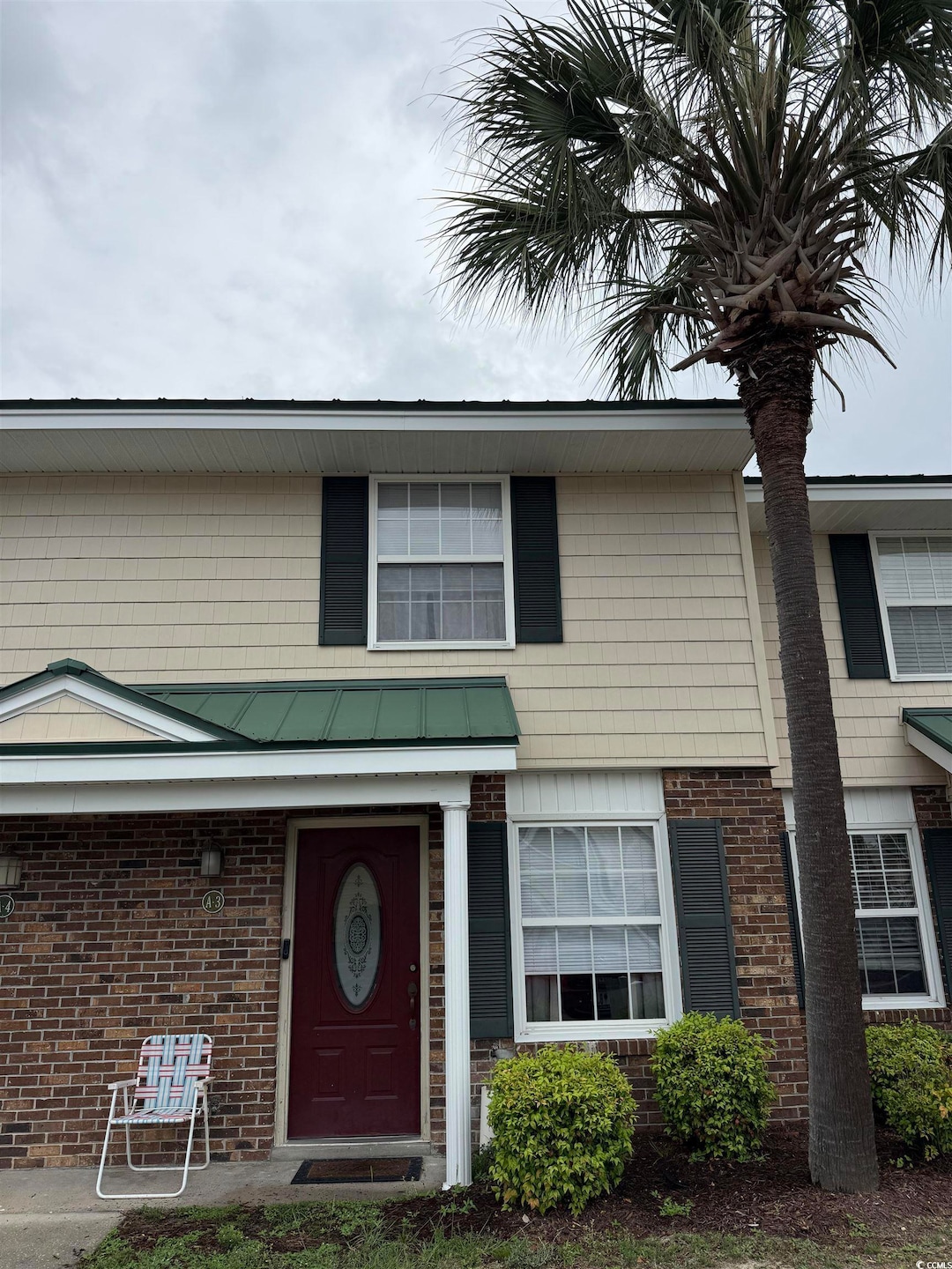 View of front facade featuring brick siding and a 