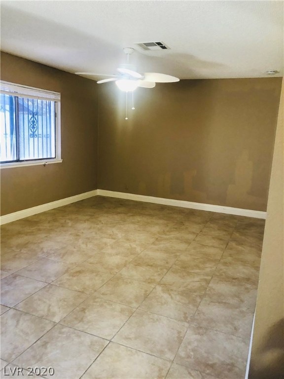 Living room with two tone paint. Tile floor.