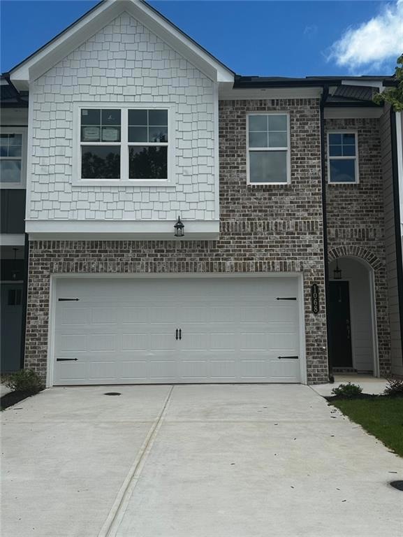 View of front of house with a garage