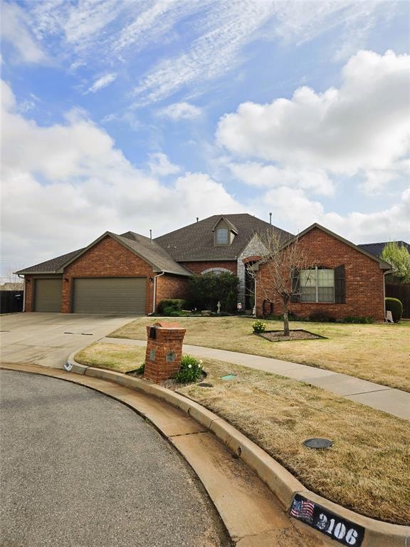 Beautiful Home featuring a front yard and 3 car ga