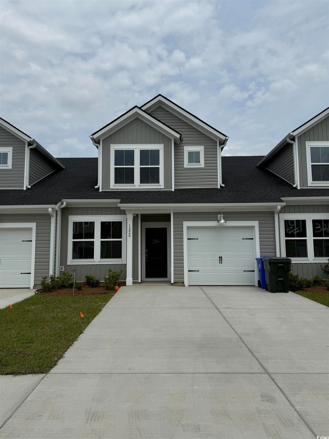 View of front facade featuring concrete driveway, 