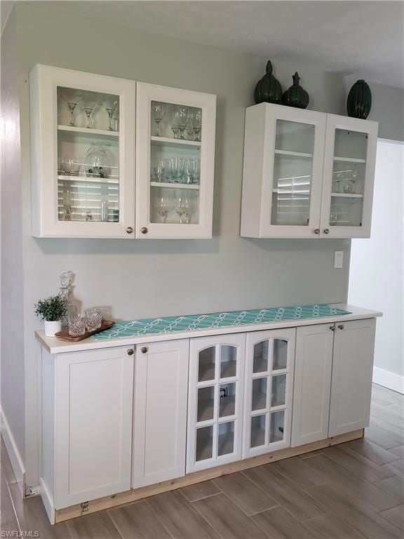 Indoor dry bar with wood finished floors